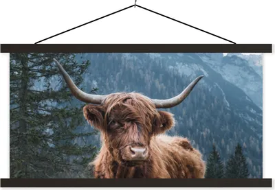 Produktbild von MuchoWow® Textilposter Schottische Hochlandrind - Bäume - Berge 150x75 cm mit schwarzem Rahmen - Posterleiste
