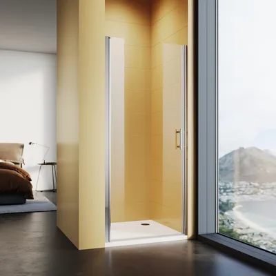 A modern bathroom with a shower enclosure and a view of a coastal city.