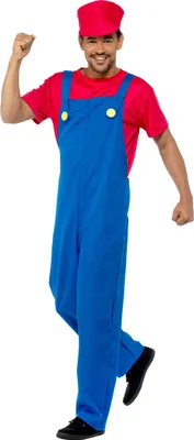 A man wearing a red shirt and blue overalls, with a red cap, posing for a photo.