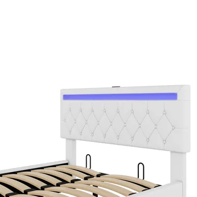 A close-up view of a white tufted headboard with blue LED lighting, part of a bed frame, against a white background.