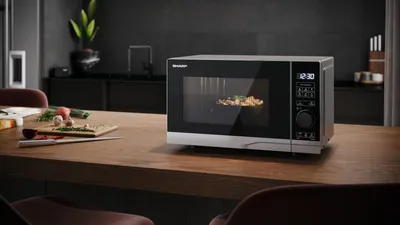 Obrázok produktu pre SHARP YC-PS204AE-S - Mikrovlnná rúra (700 W, 20 l, 10 úrovní výkonu, funkcia eco, rozmrazovanie, detská poistka), farba strieborná a čierna