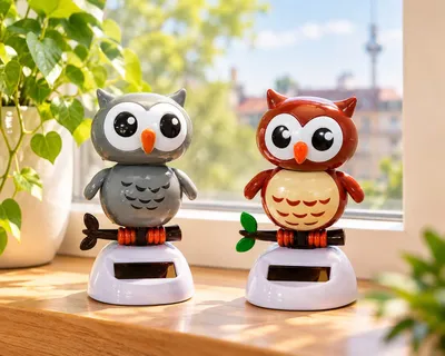 Image de Figurine d'oiseau solaire.
(Alternatively: Figurine d'une chouette à énergie solaire.)