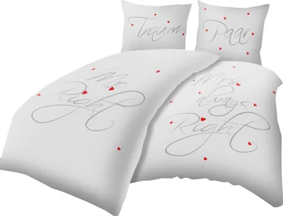 A white duvet cover and two pillowcases with romantic text and heart designs.