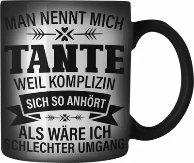 Produktbild von Trendation - Tante Geschenk Farbwechsel Zauber-Tasse Lustiger Spruch Komplizin Schlechter Umgang Geschenkidee für Beste Tante (Schwarz)