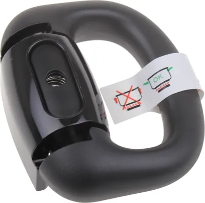 A black handle attachment for a pot or pan, with instructional stickers attached.
