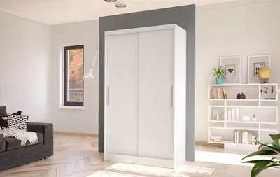 A modern white sliding door wardrobe is shown in a room with a sofa and a bookshelf.