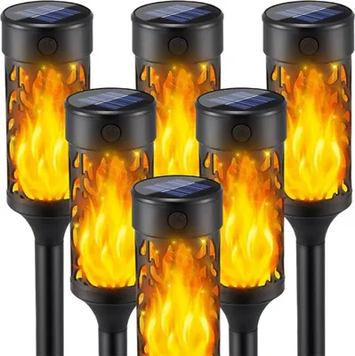 A group of solar-powered LED lights designed to look like torches with flickering flames.