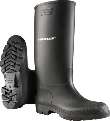 A pair of black Dunlop rubber boots shown from a slightly angled front view, with one boot standing upright and the other shown from the sole.