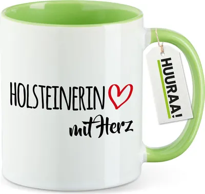 Produktbild von Huuraa Kaffeetasse Holsteinerin mit Herz 330ml Grün Keramik Kaffeebecher Geschenkidee