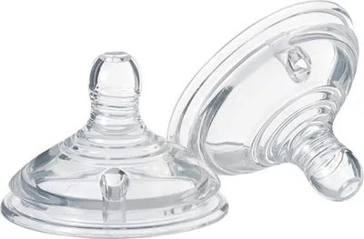Two clear baby bottle nipples are shown against a white background.