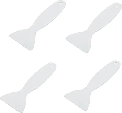 Four white plastic ice scrapers are arranged in a grid on a white background.