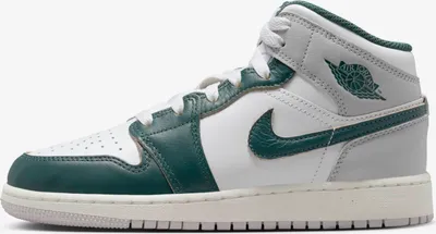 A side view of a single Nike Air Jordan 1 Mid SE sneaker.