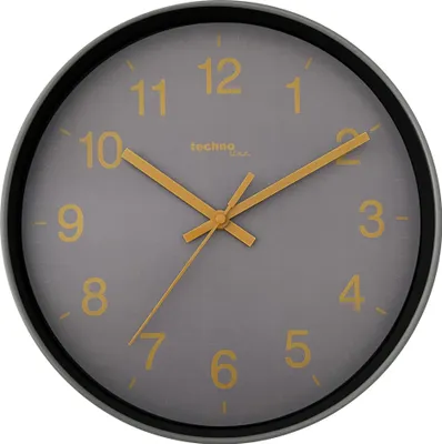 A close-up view of a wall clock with a gray face and yellow numbers and hands.