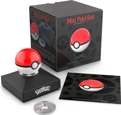 A Pokémon Mini Poké Ball electronic replica is displayed with its packaging and accessories.