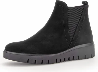 A black suede ankle boot with a wedge heel and elastic side panels, shown from the side against a white background.
