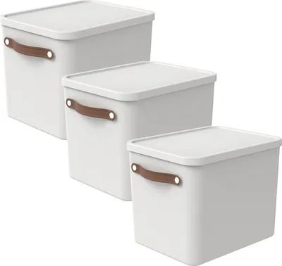 Three white storage boxes of different sizes are stacked diagonally against a white background.
