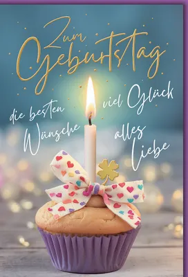 A birthday cupcake with a lit candle, a bow, and a clover charm, set against a soft blue background with bokeh lights.