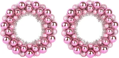 Two pink Christmas ball wreaths are shown against a white background.
