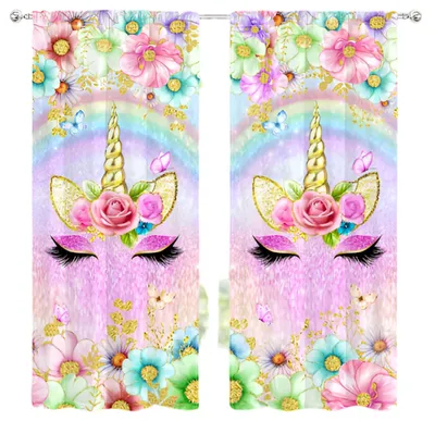 A pair of curtains with a unicorn design.