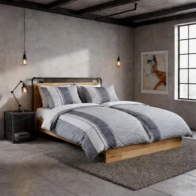A bedroom with a bed, nightstand, and artwork on the wall.