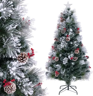 A decorated artificial Christmas tree with snow-like flocking, pinecones, and red berries, topped with a star.