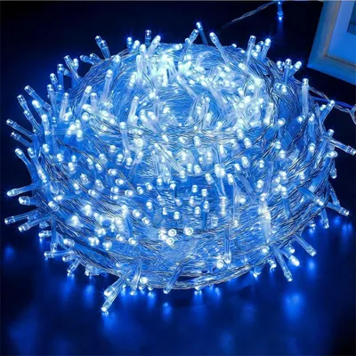 A coiled bundle of blue LED string lights on a dark background.