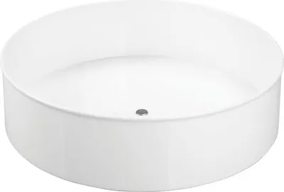 A white, round organizer or tray with a small drain hole in the center.