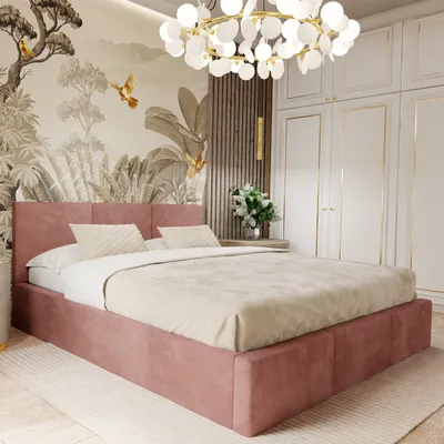 A bedroom scene featuring a pink upholstered bed with bedding, a decorative wallpaper, and a modern chandelier.