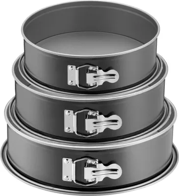 A stack of three round springform cake pans.