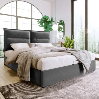 A bedroom scene with a bed, plants, and a large window.