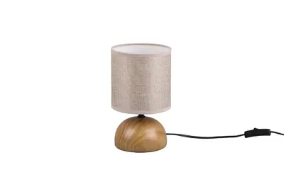 A table lamp with a beige fabric shade and a wooden base.