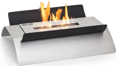 A portable ethanol tabletop fireplace with flames burning.