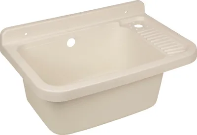 A beige plastic sink basin with a ribbed drainboard and mounting holes.