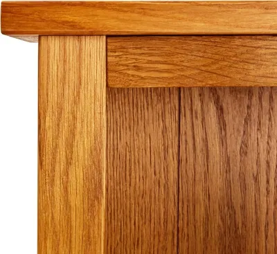 A close-up view of the wood grain and joinery of a wooden furniture piece.