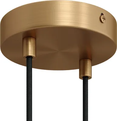 A close-up view of a golden metal ceiling rose with two black cables emerging from it.