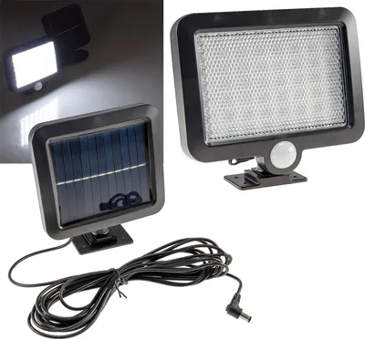 A product shot of a solar-powered LED light with a separate solar panel and a coiled cable.