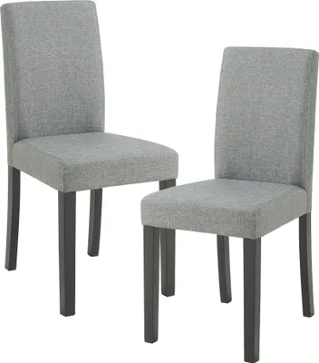 Two gray upholstered dining chairs with dark wooden legs are shown against a white background.