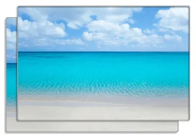 Produktbild von Wallario Frühstücksbrettchen 2er Set aus Glas, je 20 x 30 cm, mit rutschfesten Füßen, Motiv Sandstrand und blaues Meer