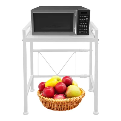 A white microwave stand with a microwave on top and a basket of fruit below.