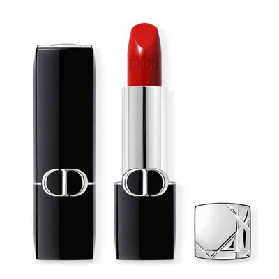 A red Dior lipstick is shown with its black case and silver cap, all on a white background.