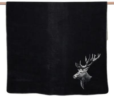 A black blanket with a stag's head printed on it.