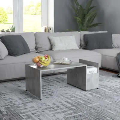 A modern living room with a sectional sofa, coffee table, and rug.