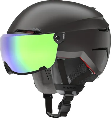 A black ski helmet with a green visor, shown from a three-quarter angle against a white background.