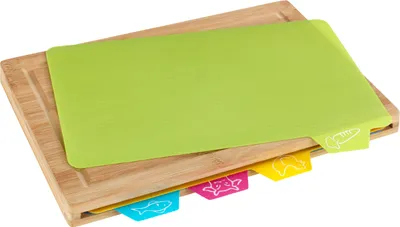 A set of bamboo cutting boards with colorful mats.