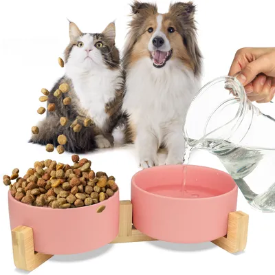 Produktbild von MERSJO Keramik Doppelschale Holz, Fressnapf Hund und Katze, Bowl Schüssel mit 2 Keramiknäpfen auf Stabilem Naturholzsockel, 2x400 ml, Rosa