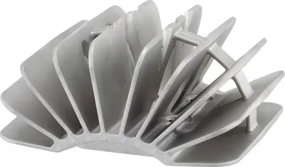 A close-up studio shot of a silver-colored engine cylinder head.