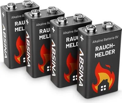 Four 9V batteries are arranged in a diagonal line on a white background.