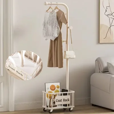 A coat rack with clothes and a bag hanging on it, and a storage basket at the bottom.