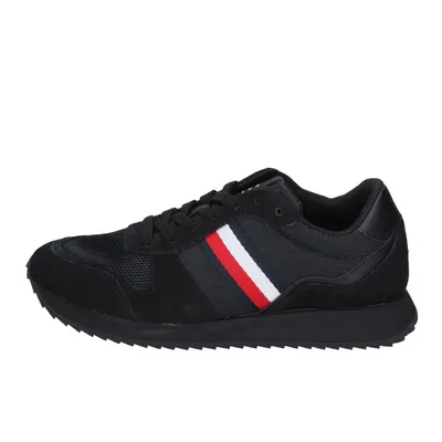 A single black sneaker is shown from the side against a white background.