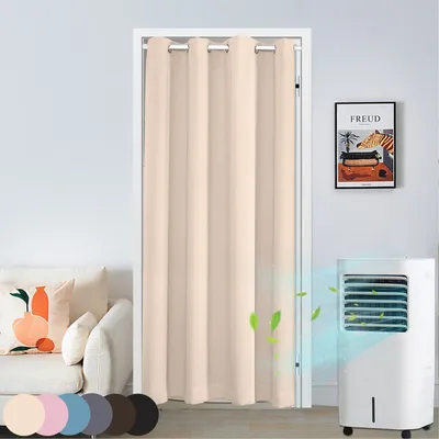 A beige door curtain hanging in a doorway, with a couch and a portable air cooler visible in the room.